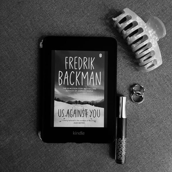 A copy of Us Against You by Fredrik Backman.